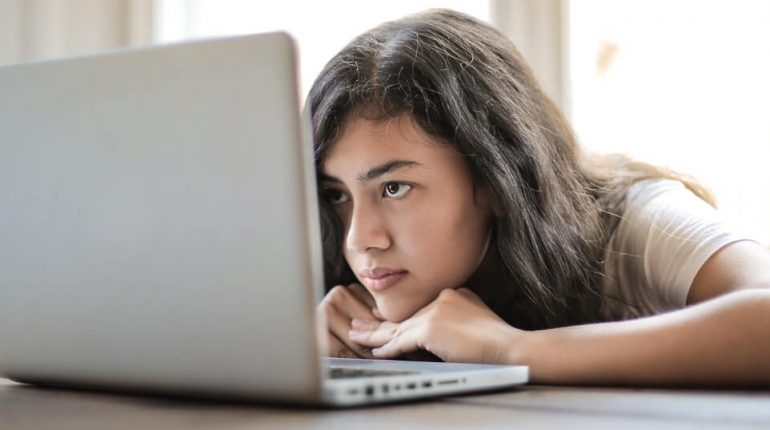 Image of a woman using her laptop